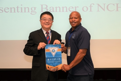 President Jan Fuh-Jyh of National Chung Hsing University presents a flag to Major General Craig Timberlake, Chief of Student Leadership Development at ILTEXAS.