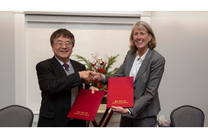 USU President Noelle Cockett and NCHU Vice President and Dean Fuh-Jyh Jan celebrate the signing of an agreement between USU and NCHU that creates a joint Ph.D. program in engineering disciplines.
