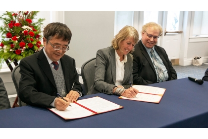 NCHU Vice President Fuh-Jyh Jan (left) and USU President Noelle Cockett sign the joint agreement between USU and NCHU for a collaborative Ph.D. program in engineering disciplines. USU Vice Provost of Graduate Studies Richard Culter (right) also signed.