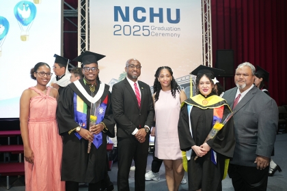 Palau Ambassador Extraordinary and Plenipotentiary to Taiwan David Adam Orrukem (first from right) and Elroy Wilson, Minister Counsellor of the Embassy of Saint Vincent and the Grenadines (third from left), attend NCHU’s commencement ceremony and pose for