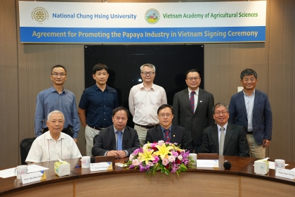 Group photo of distinguished guests at the signing ceremony.